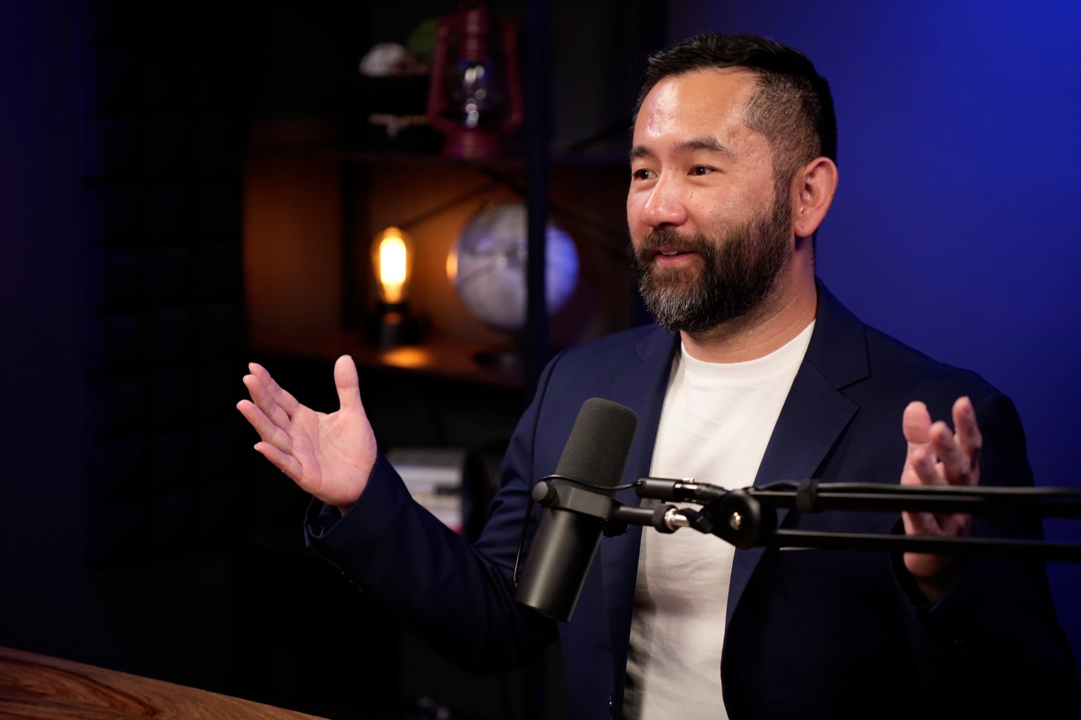 Mike Zhang in conversation at a podcast microphone